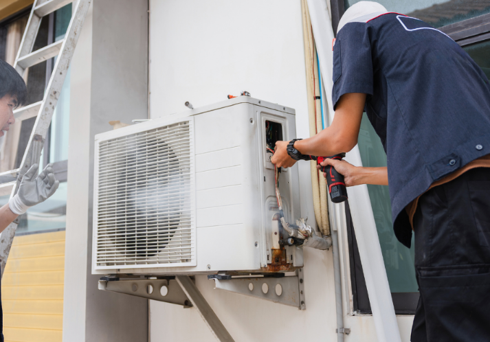 Technician fixing the heat pump.