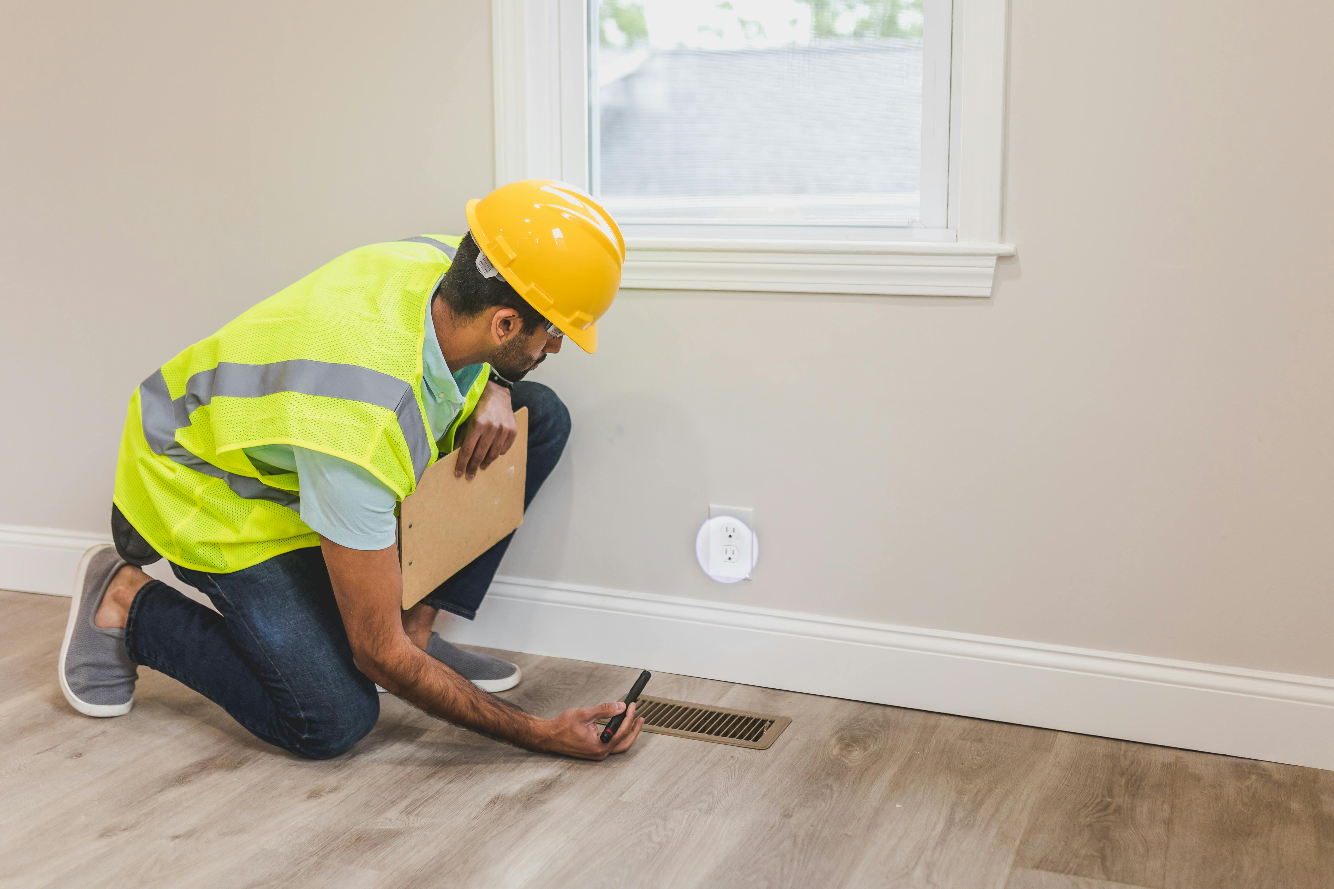 technician looking at a vent